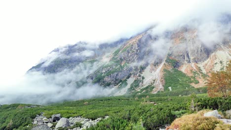 valley in the high tatra mountains, clouds are rising up