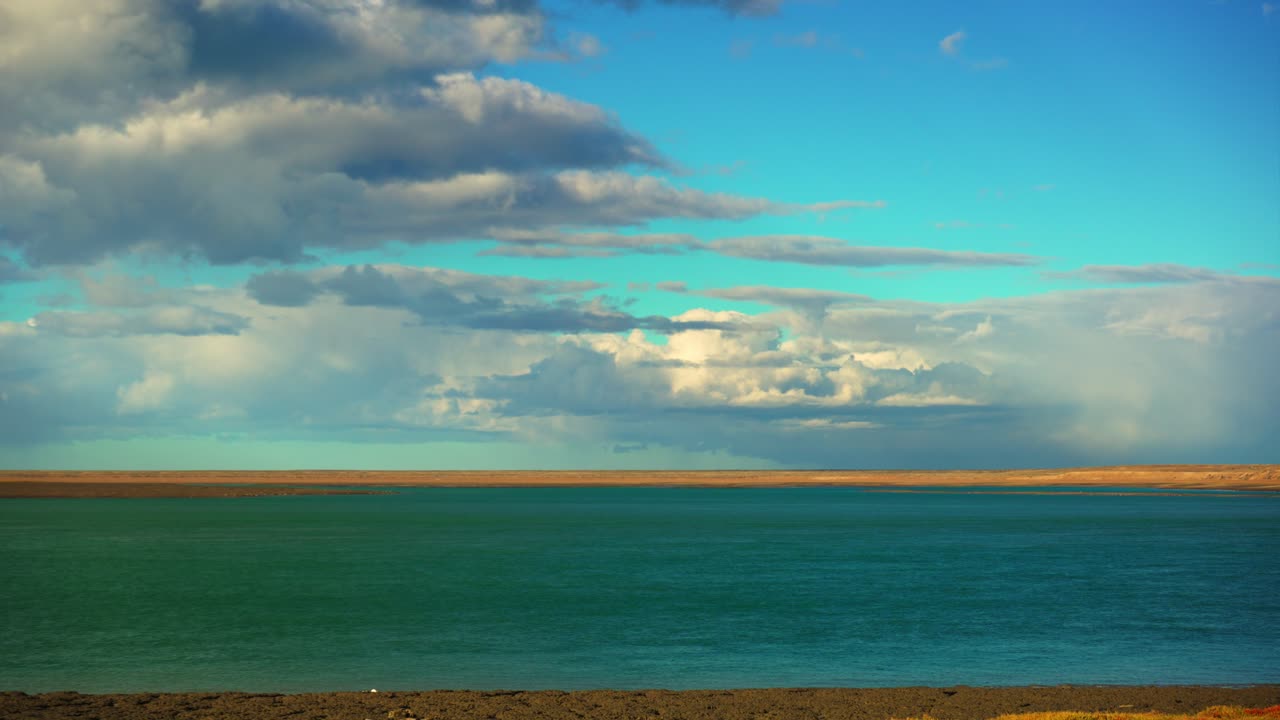 Timelapse of Coastal Clouds and golden Light Over the Atlantic Shoreline in Santa Cruz, Argentina