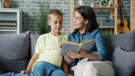 mother and son reading a book together