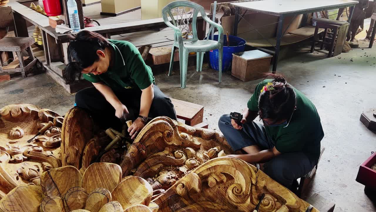 Skilled Women Artisans Meticulously Carving Intricate Wooden Designs
