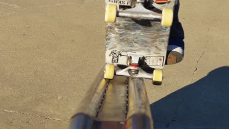 skater does a trick on ledge at the skate park