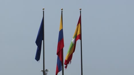 flags of cartagena de indias and colombia flag in parque de la marina , cartagena, colombia