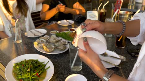 group preparing food at a dining table