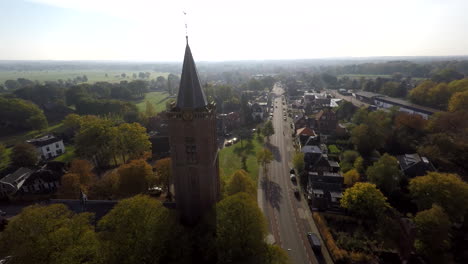 Church-in-rural-area-next-to-road---Drone-moving-away