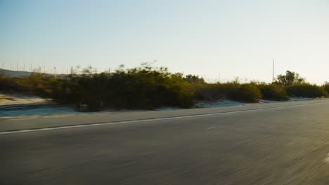palm springs empty road in california sunrise