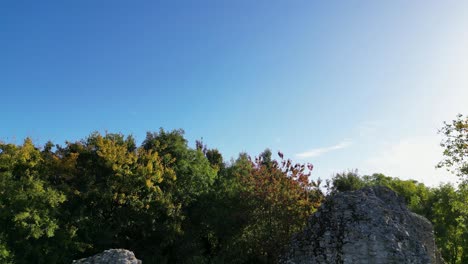 A-12th-Century-Norman-keep-set-amongst-green-yellow-and-brown-Autumn-trees-in-Sutton-Valence