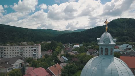 church in the village near mountings. cloudy weather. aerial view