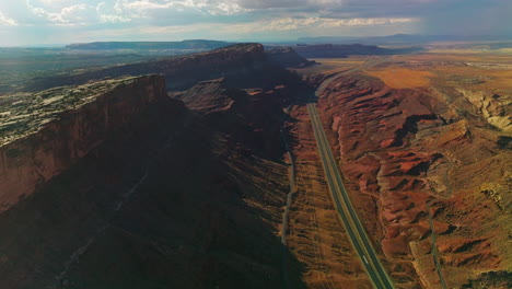 flying above the motorways at the foot of fascinating canyons. spectacular view of rocky relief from aerial perspective.