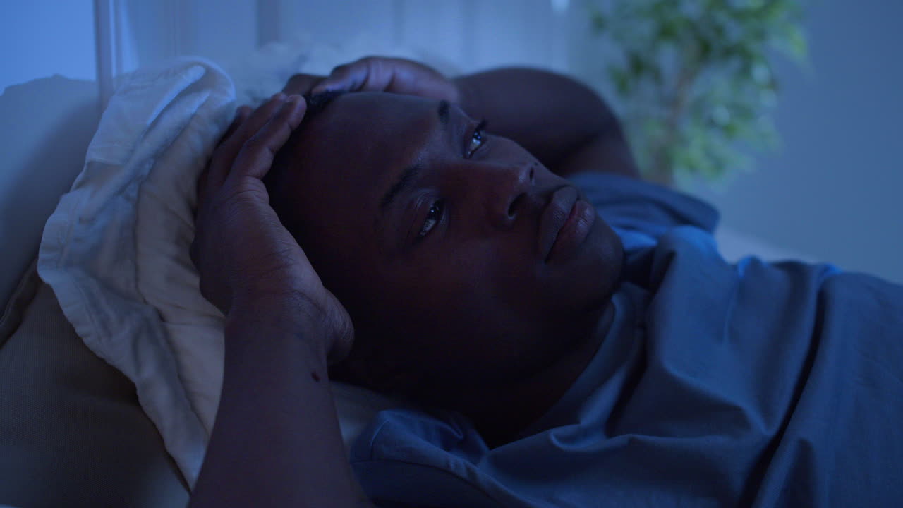 Closeup of man trying to sleep