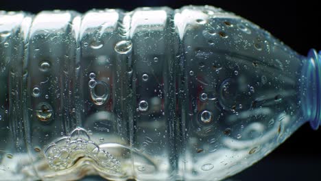 close-up of a water bottle demonstrating surface tension, air bubbles, and reflections captured in stunning detail