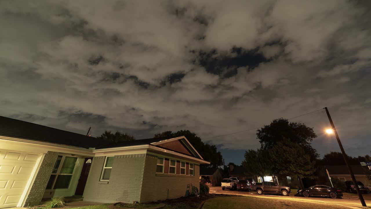 Residential Street at Night with Cloudy Sky