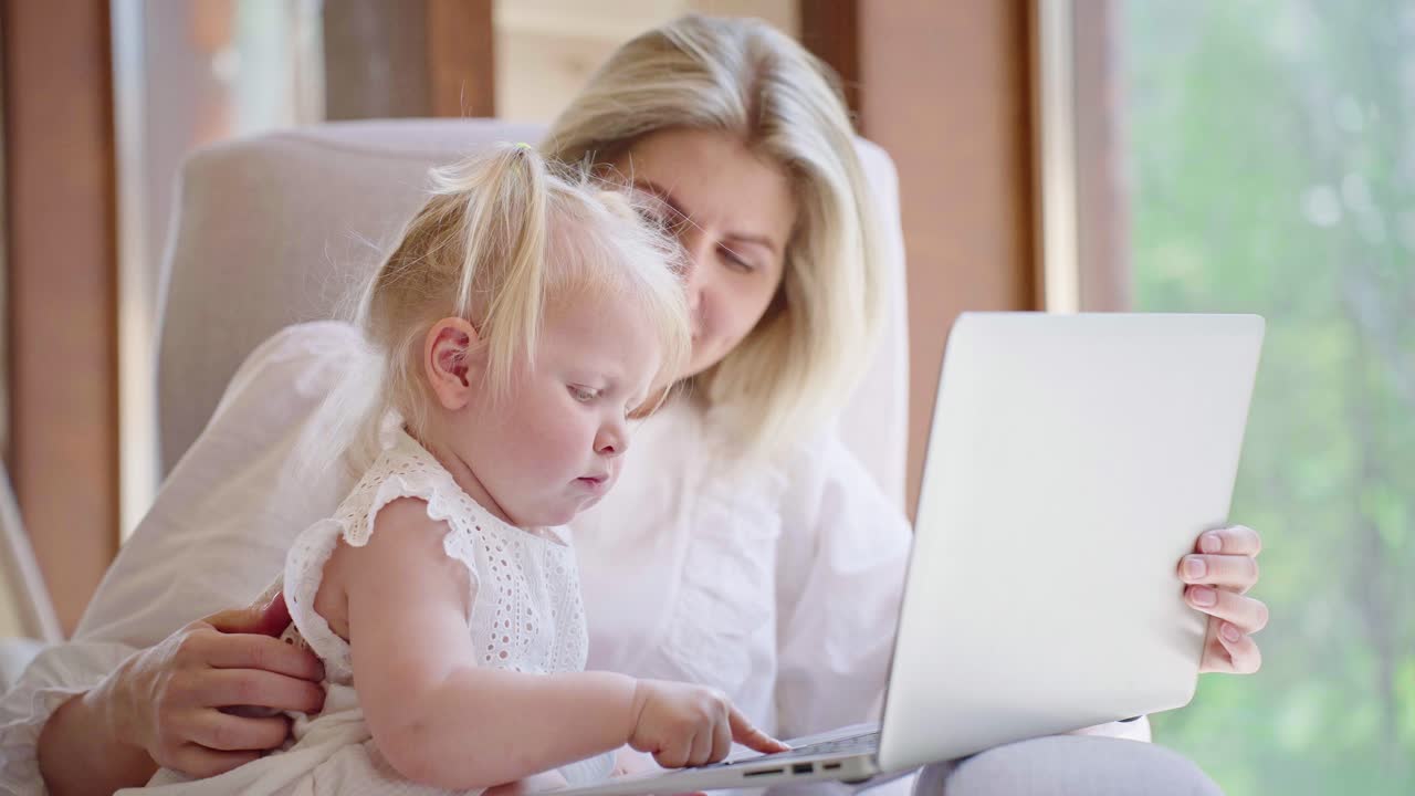 Mother and Toddler Learning on Laptop