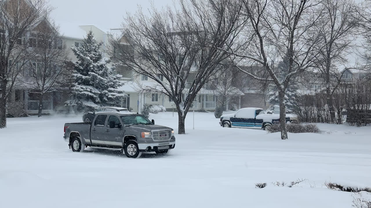 Pickup truck on snowy road in Swift Current in Saskatchewan, Canada