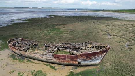 shipwrecked boat river medway kent uk close up drone aerial view