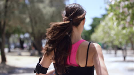 Rear-view-Athletic-running-fitness-woman-in-urban-city-slow-motion