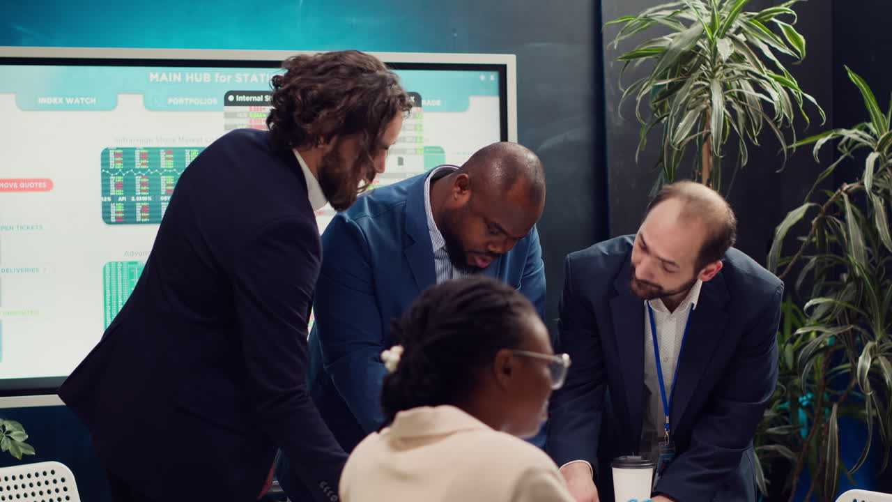 Business associates reviewing latest financial plans on documents