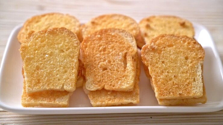 baked crispy bread with butter and sugar