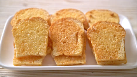 baked-crispy-bread-with-butter-and-sugar