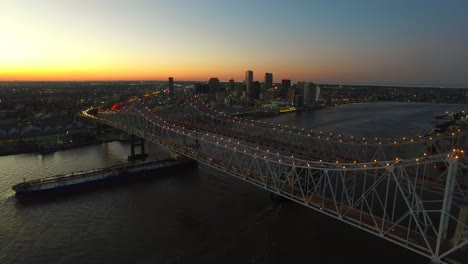 beautiful night aerial shot of the crescent city bridge over the mississippi river revealing the new orleans louisiana skyline 2