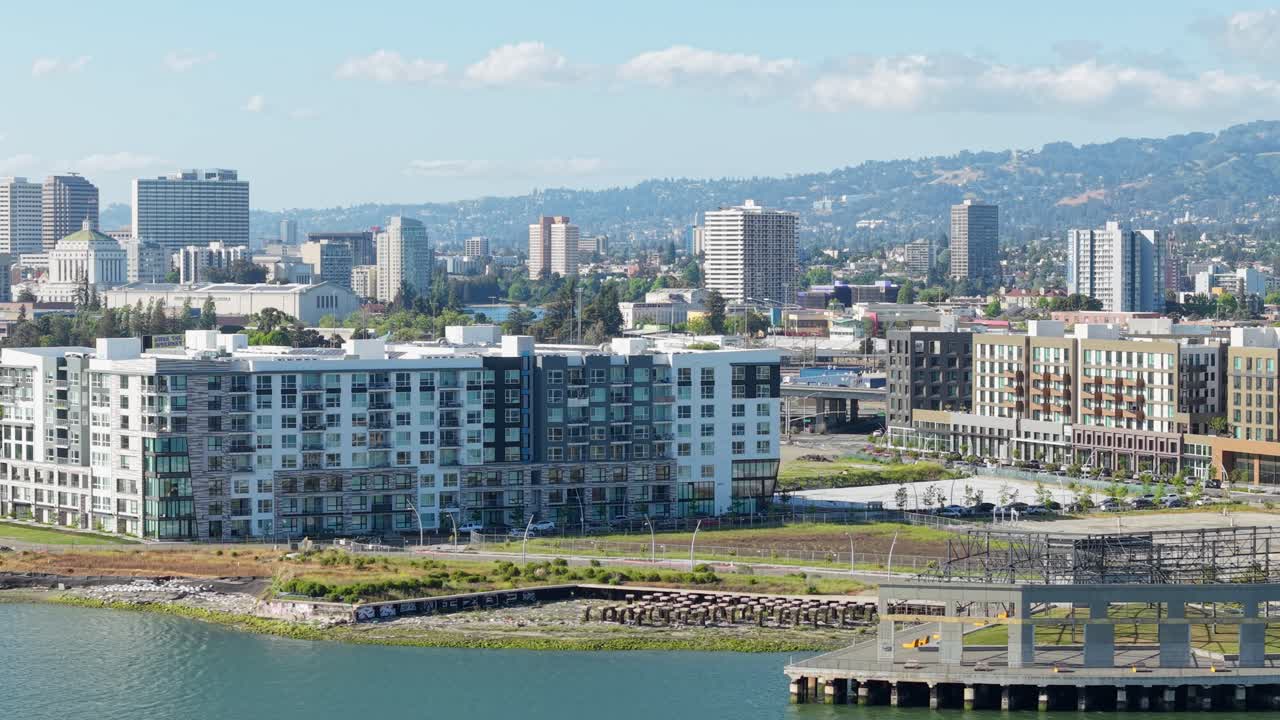 A sunny aerial panning view of the waterfront in downtown Oakland California filmed in real time.