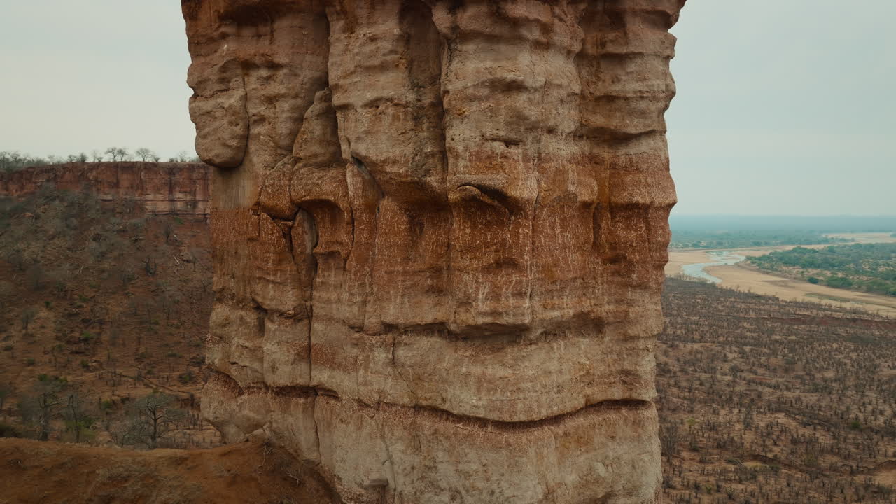 Aerial drone footage of the iconic Chilojo Cliffs in Gonarezhou National Park, Zimbabwe. Close up shot. Dramatic sandstone escarpment rising above the savanna part 8