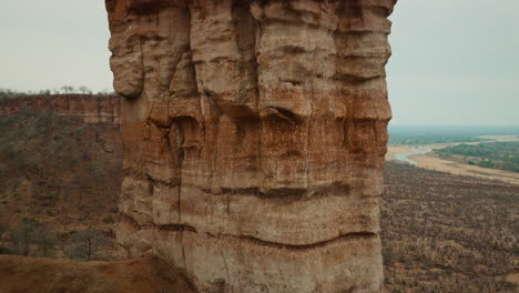 aerial drone footage of the iconic chilojo cliffs in gonarezhou national park, zimbabwe. close up shot. dramatic sandstone escarpment rising above the savanna part 8