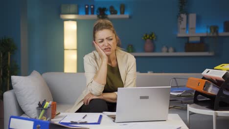 home office worker woman teeth aches and pains.