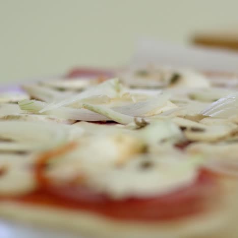 Close-up-of-hands-preparing-food-on-table