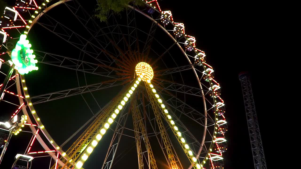 Ferris wheel at amusement park , night shot