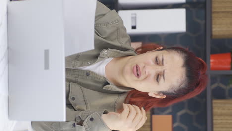 Vertical-video-of-Business-woman-upset-with-negative-paperwork-results.