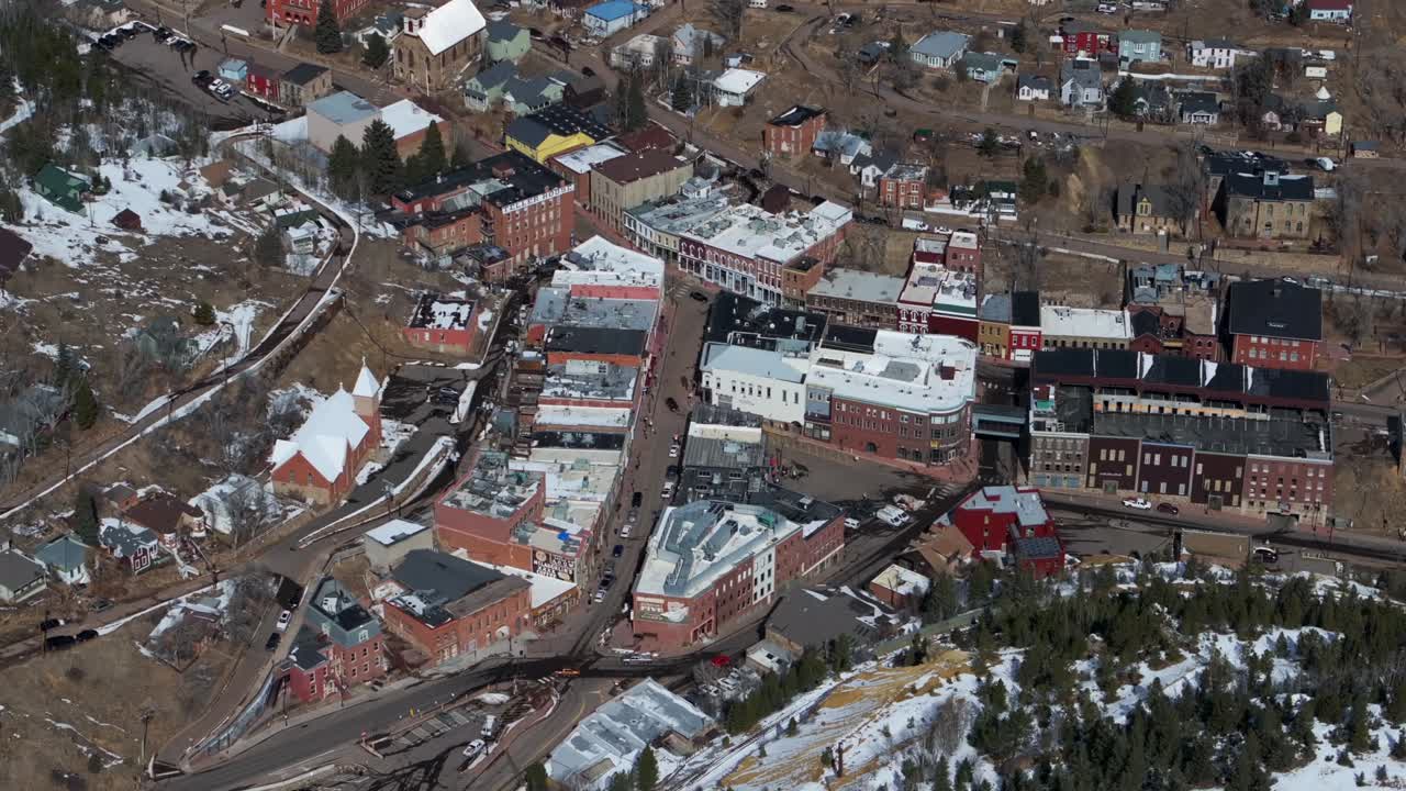 Downtown Central City Black Hawk Colorado Birds Eye view aerial drone view city historic buildings townhall winter sunny daytime bluesky Gold mining town streets casinos circle right motion