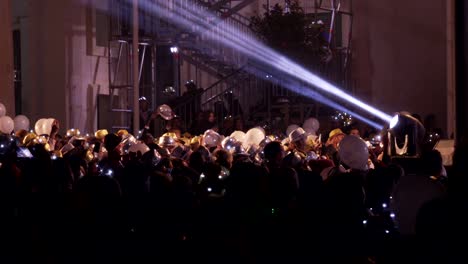 crowd of happy people under the stage during the new year's concert