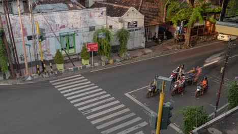 view of a busy city street with vehicles and traffic lights