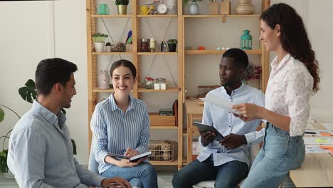 multicultural creative businesspeople gather on informal briefing smile discuss startup