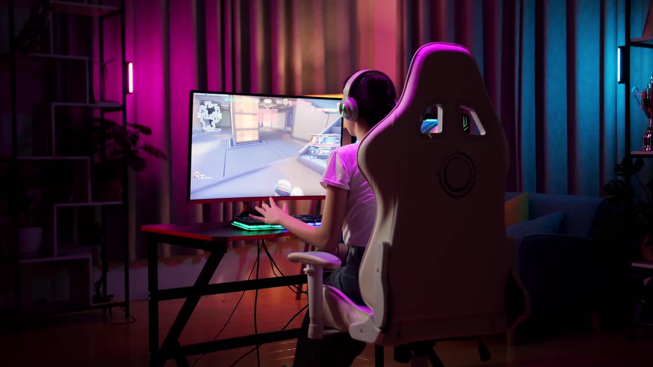 Asian Teen Girl Gamer Lose While Playing Video Game On Computer, Shooter Online Video Game