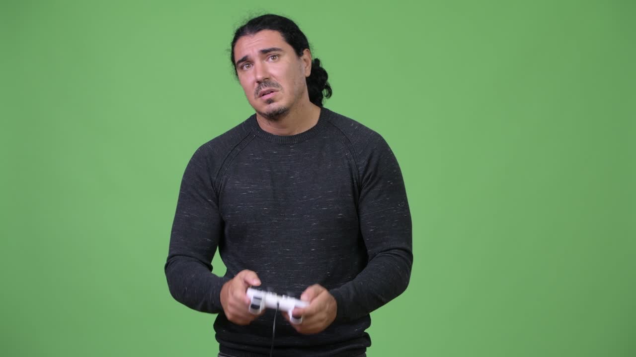 Handsome man playing games and losing