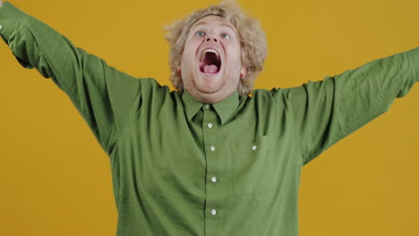 happy man with raised arms