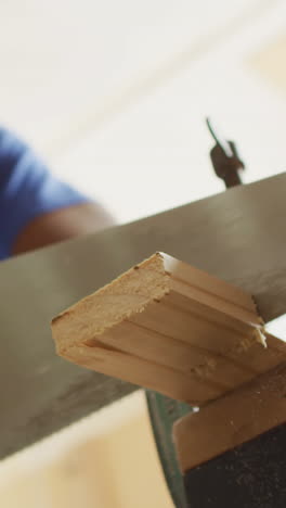 craftsman working with wood in a workshop, with copy space