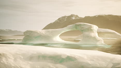 stunning iceberg arch in the arctic