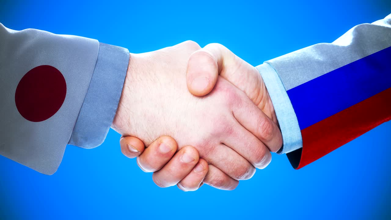 - rusia japón apretón de manos concepto de animación sobre los países y la política con el canal mate /