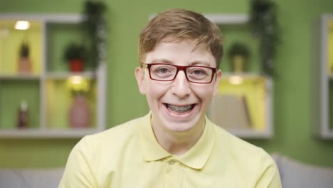 young man with braces looking at camera close-up