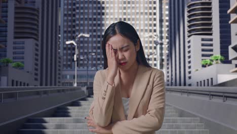 stressed businesswoman in city