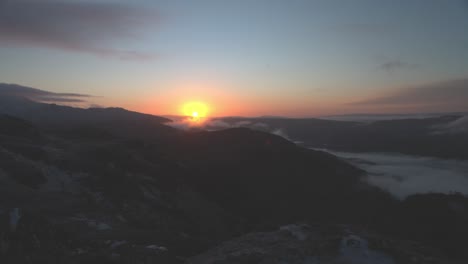 vibrant sunrise over ben a'an with low lying misty in the scottish highlands