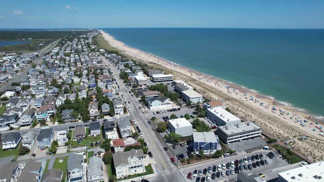 Descending drone of Delaware beaches and coastline looking north perfect summer day