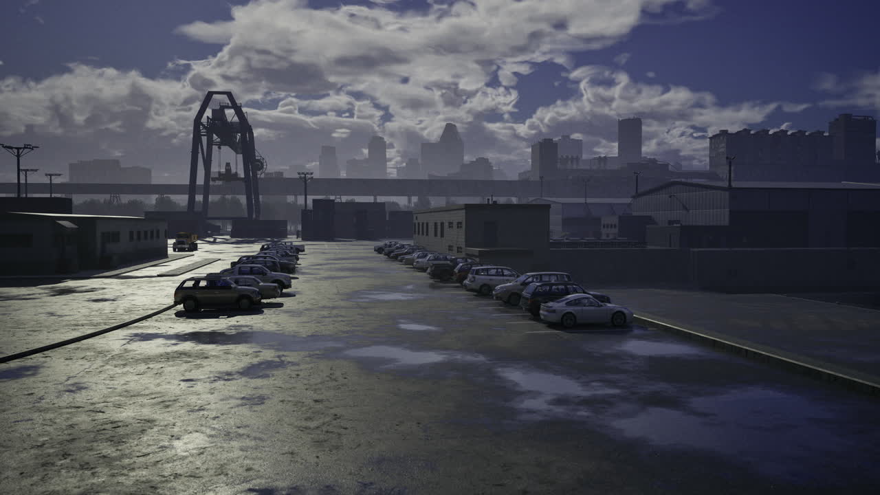 Industrial area with parked cars and cloudy skyline during twilight