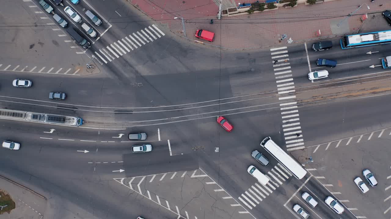 Aero shooting from above at the crossroads. City traffic. Traffic jams during rush hour in the city. White road markings
