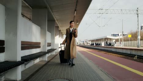 woman waiting at train station