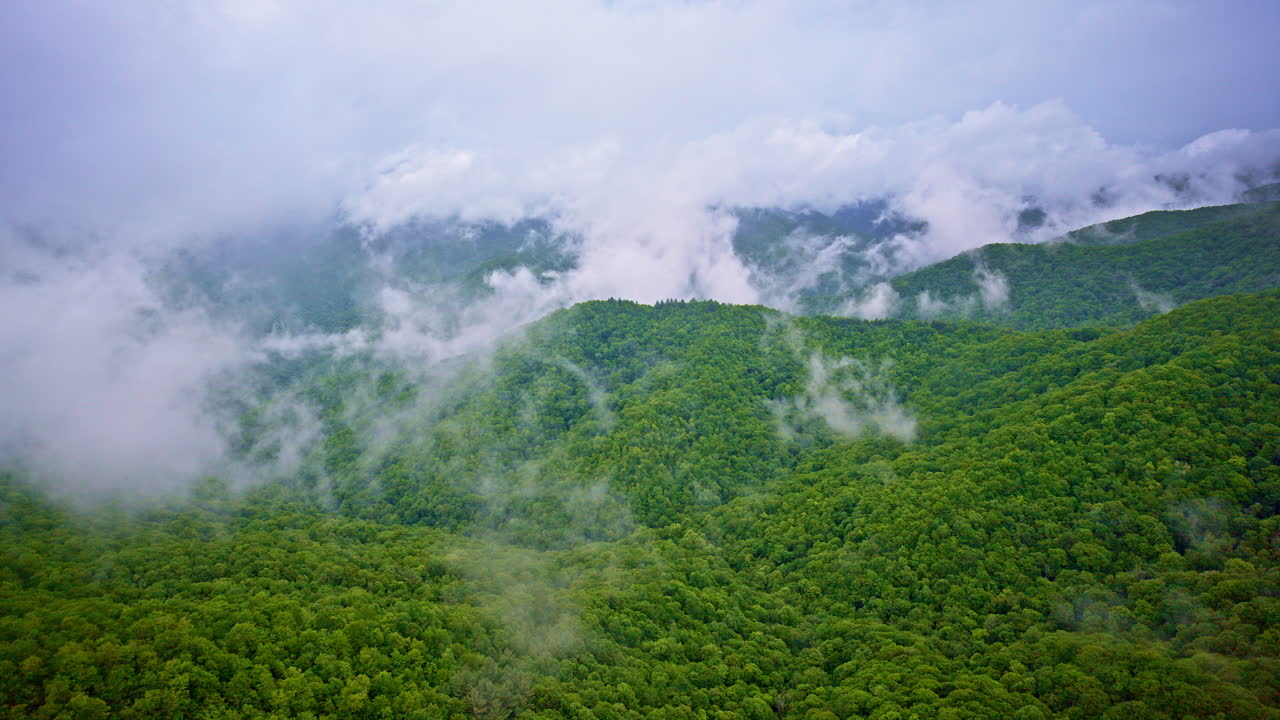 Drone flies over hazy hills in the heart of the Smoky Mountains