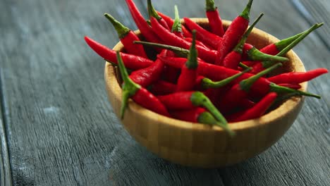 wooden bowl full of chili pepper