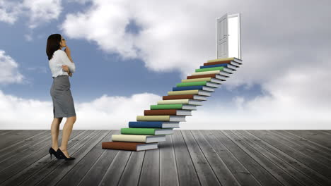 businesswoman looking at stair made of books on a wood ground